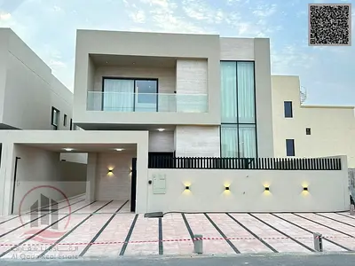 Villa for sale in Ajman, Al Zahiyah area. 5 master bedrooms, majlis, 2 living rooms, and a maid's room. Freehold ownership for all nationalities. Bank