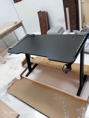 Black gaming/computer desk with cup holder and cable grommets