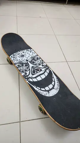 Complete skateboard with skull graphic - used, ready to ride