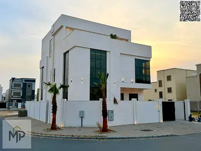 A villa with all-inclusive price (electricity, water, and air conditioning) on ​​the main street, ready to move in, in one of Ajman's most prestigious