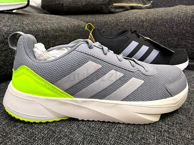 Light grey Adidas sneakers with neon-green heel — lightly used size F40