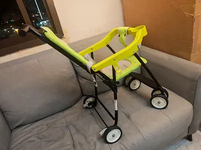Lightweight green baby stroller - used, working condition
