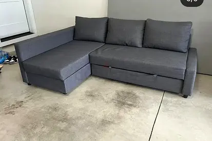Grey L-shaped Sofa Bed with Chaise and Storage - Good Condition