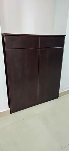 Dark wooden shoe rack