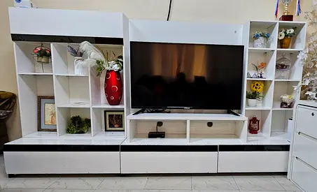 White TV entertainment unit with shelves and drawers