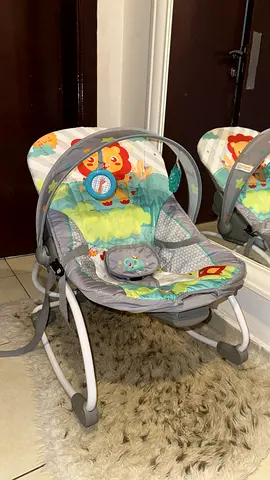 Gently used baby rocker/bouncer with toy bar
