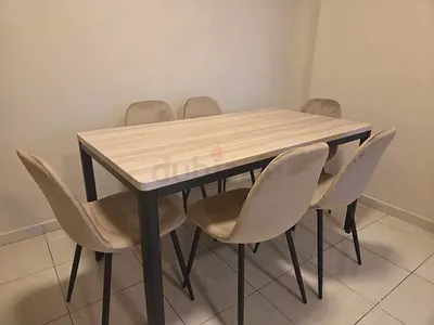 Light wood 6-seater dining table with beige velvet chairs. 150 cm L x 80 cm W x 75 cm H