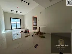 Two-bedroom apartment with a living room and an open view for annual rent in Rashidiya 1. Prime loca