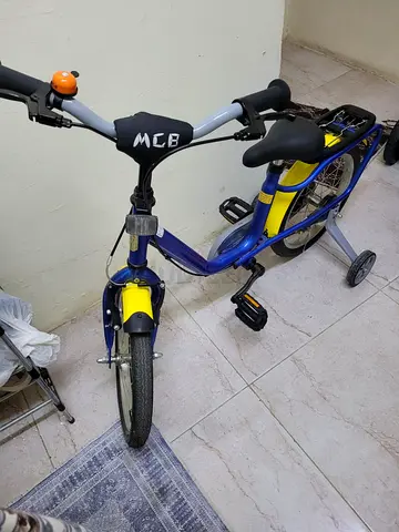 My kids blue  yellow bicycle - good working condition  16 Inch