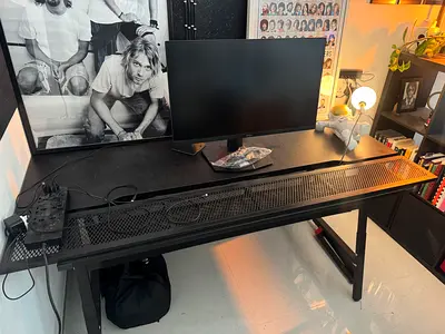 Black metal mesh computer desk — long sturdy table