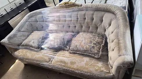 Beige tufted 3-seater sofa with cushions,