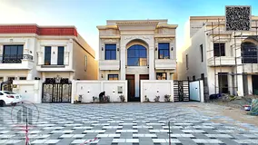 Villa for sale in Ajman, Al Zahia area. 5 master bedrooms, living room, majlis, roof terrace, maid&#