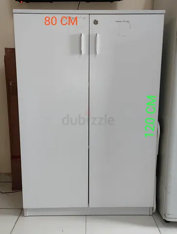 My white 2-door storage cabinet — 80 x 120 cm  Brown 70 x 75 cm