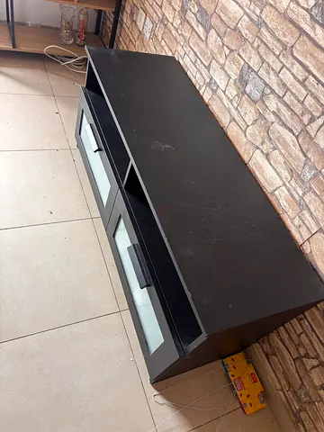 My black TV stand / entertainment unit with frosted glass drawers