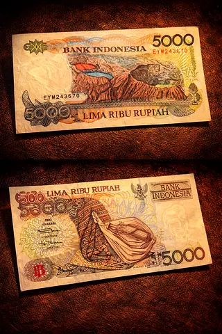 Indonesian 5000 Rupiah banknote with cultural artwork. UNC