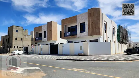 Villa for sale in Ajman, Al Zahia area, including registration, 5 master bedrooms, majlis, living room, roof terrace, and maid's room, with registrati