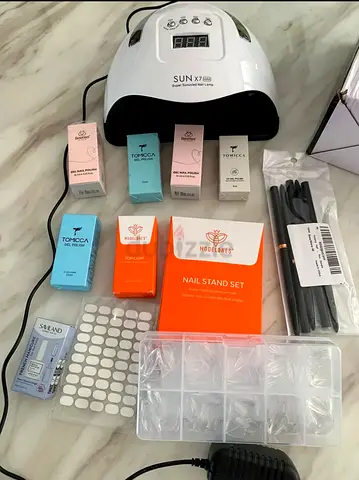 My complete gel nail kit — SUN X7 LED lamp, polishes, tips and tools (negotiable)