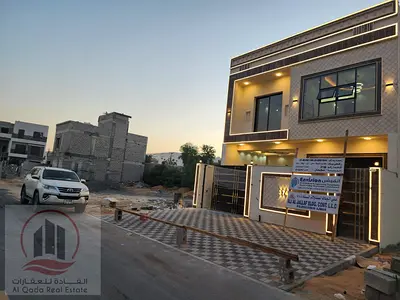 For sale, a villa in Ajman Al Helio, 5 master rooms, a Majles room, a hall, and a maid’s room, freehold for all nationalities