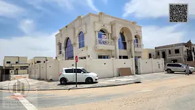 Villa for sale in Ajman, Al Zahia area. It features 5 master bedrooms, a majlis (formal sitting room