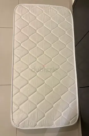 Used baby crib mattress — clean, firm, fits standard cot