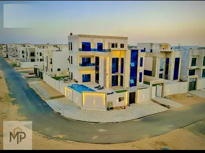 فيلا( زاويه )7 غرف ومجلس و 3 صالة ومسبح ومصعد | تملك حر| بسعر شامل رسوم التسجيل والماء والكهرباء والمكيف المركزى والفرش.