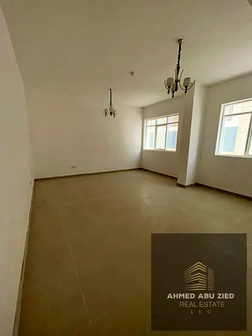 Apartment for rent in Princess Village – Ajman, 2 bedrooms + living room, master bedroom, 3 bathrooms, balcony with open view, built-in wardrobes, dir