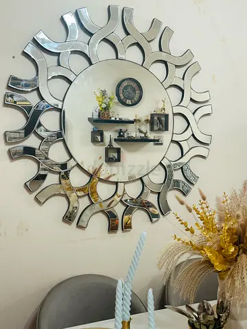 Mirror with Unique Sunburst Design  Console Table with all decorative items including wall mirror.