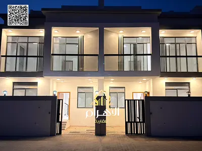 Luxury villa for sale in Al Bahia area, featuring two floors and a rooftop terrace. Modern design, spacious living areas, reception halls, and compreh