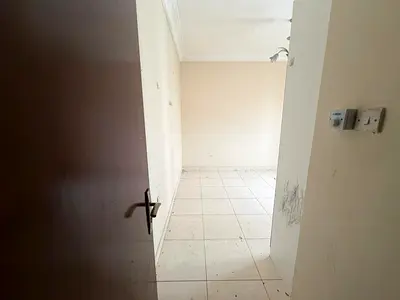 One bedroom and living room for rent in al Nahda, spacious area, free maintenance