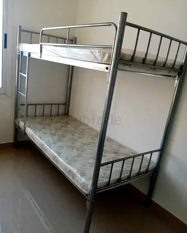 Metal bunk bed with two mattresses (good condition)