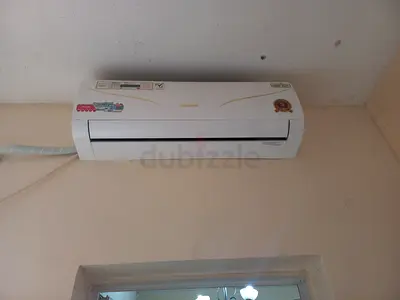 New 7 month Used wall-mounted split air conditioner - moving out sale.800 dhs with Guarantee and war