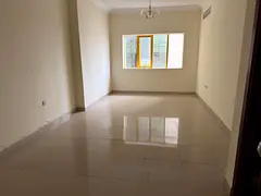 The cheapest two-bedroom apartment with a living room and parking in Al Taawun.