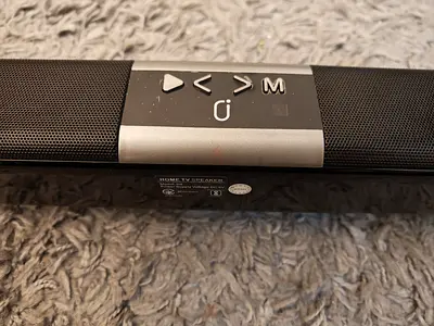 Compact black soundbar - slim TV speaker (good condition)