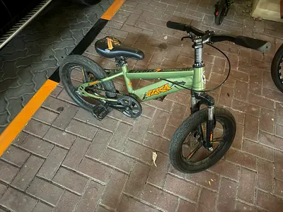 Green 16 kids BMX-style bike — good condition