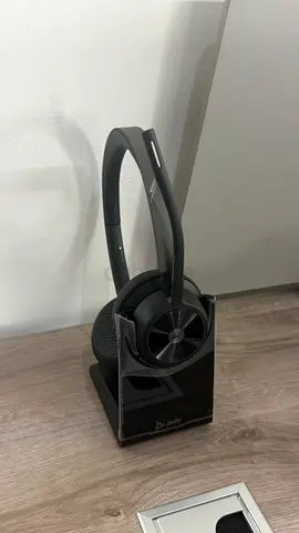 Poly wireless headset with charging base