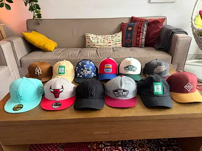 Lot of 12 mixed baseball caps — NY, LA, Bulls, Nike, Vans (used)