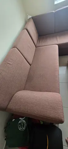 Gently used brown 4-seater fabric sofa with Glass Top T table