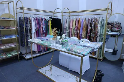 Golden, double sided hanger for boutique dresses and abayas with tires