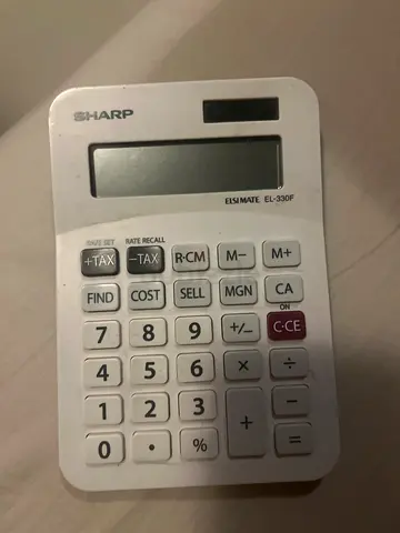 Used Sharp desktop calculator (solar/battery) - working