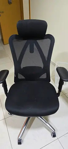 My black electric height-adjustable standing desk  along with chair— good condition