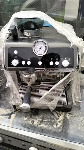 Used DeLonghi espresso machine with built-in grinder