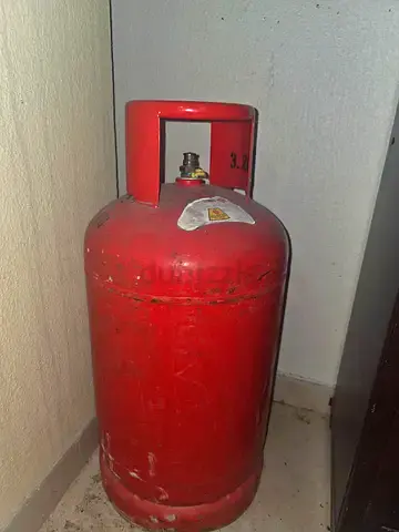 Used red LPG gas cylinder - good working condition
