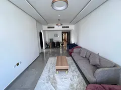 Two-bedroom apartment with a living room - Al Nuaimiya 3, Ajman - Central air conditioning - Family