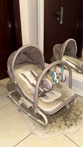 Baby rocker/bassinet with detachable toy bar — gently used
