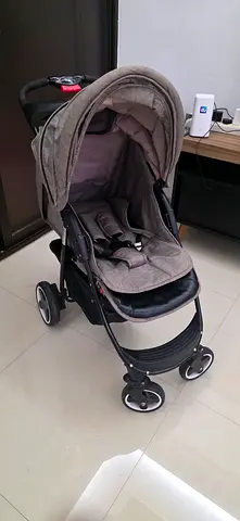 Compact 4-wheel baby stroller in good condition