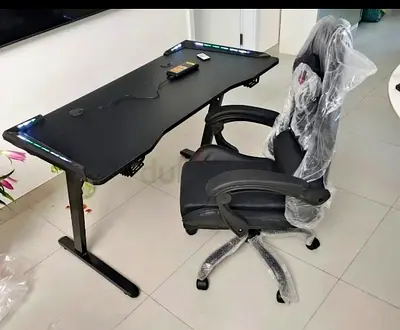Black gaming computer desk with LED lighting + padded swivel office chair (set)