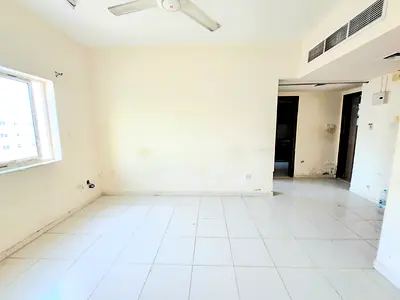 LAVISH 1BHK WITH CENTRAL AC ON ROAD BUILDING IN MUWAILEH