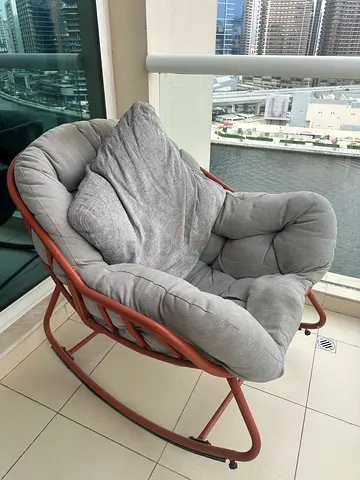 My grey cushioned rocking lounge chair - gently used