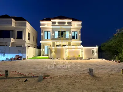 Luxury villa for sale, including registration and ownership fees, near Azha Community. Featuring a modern design and high-end finishes, spacious livin