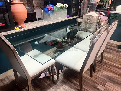 6-seater glass dining table with upholstered chairs